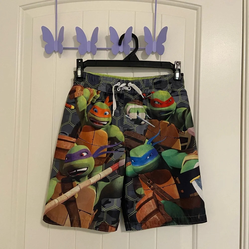 EUC | Nickelodeon boy’s Teenage Mutant Ninja Turtles swim trunks‎ — size 7